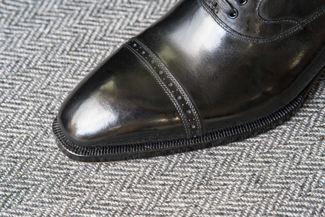 Tight sole stitching, but not the cleanest welt finish.