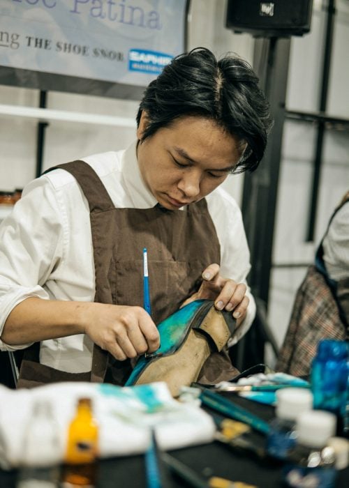 John Chung painting shoes.